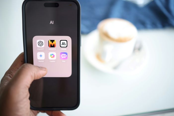 A mobile phone with popular AI applications on its screen